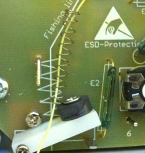 Thread the spring over the cord is easier than trying to do it in situ. vsb-door-opener-4